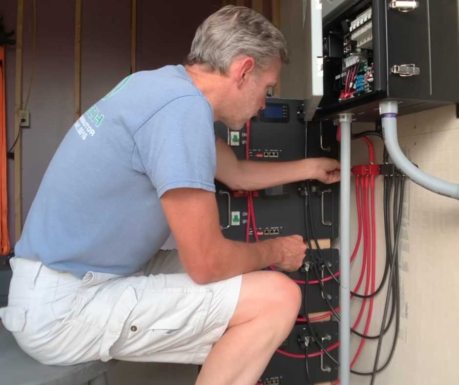 Man fixing the solar's electrical system