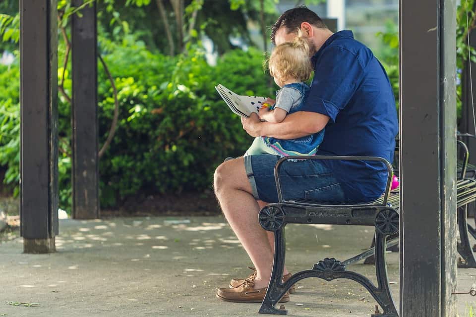 Dad reading to child