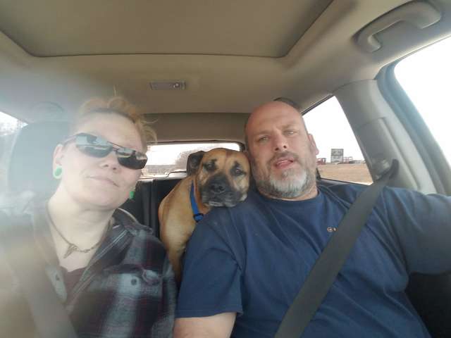 Angela, Bill, and River in the car