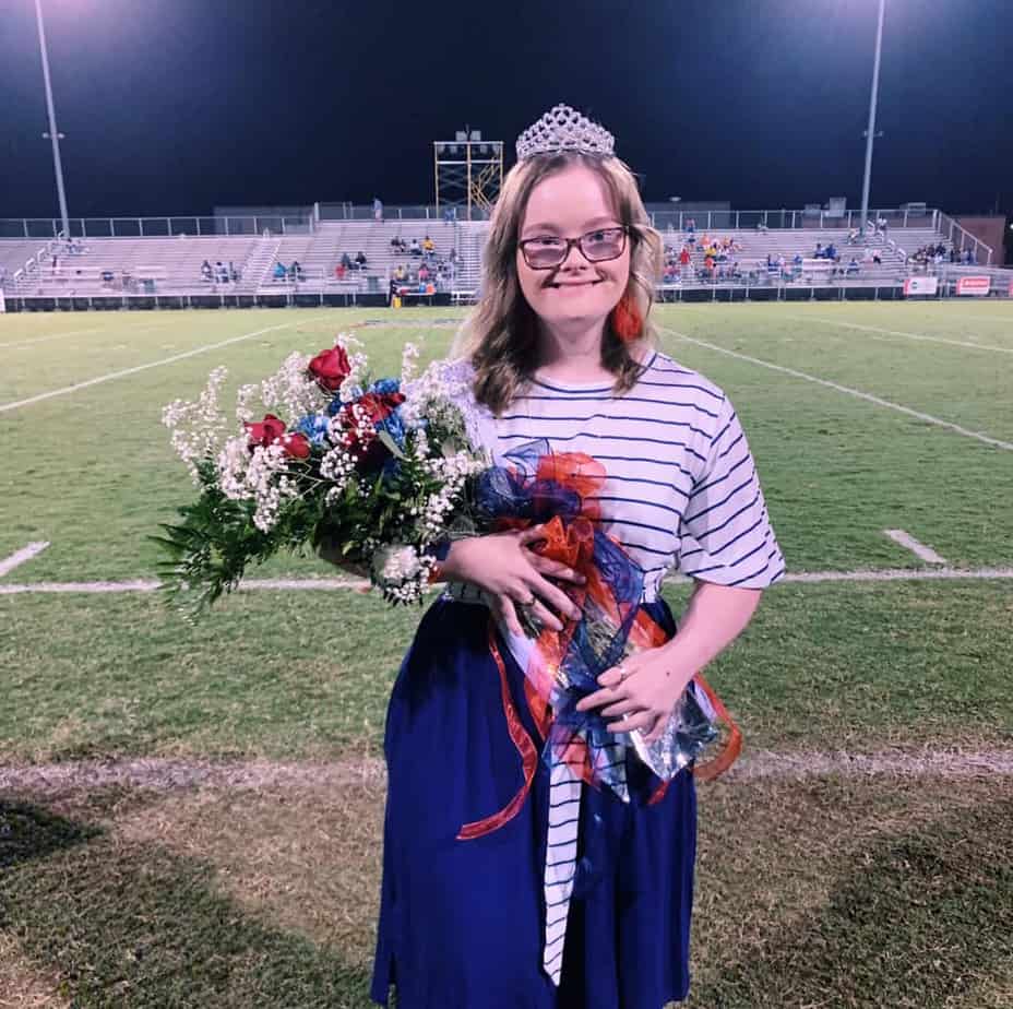 queen candidates walk barefoot in support of a fellow