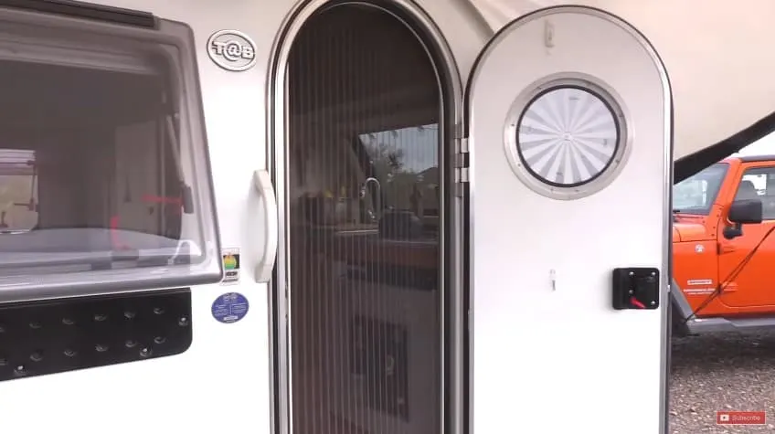 The screened door to her mobile home.
