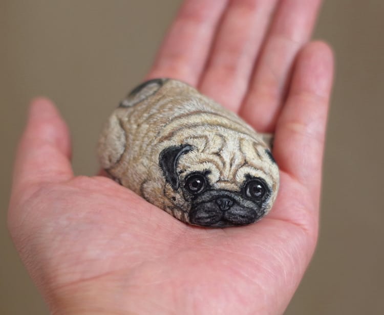 An image of a pug painted on a stone by Akie Nakata