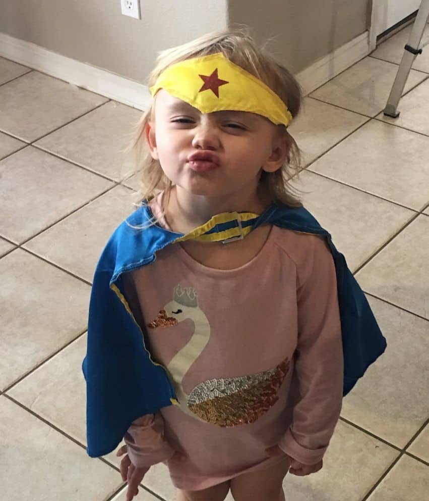 Kaila Zach in her Wonder Woman costume giving the camera a playful kiss.
