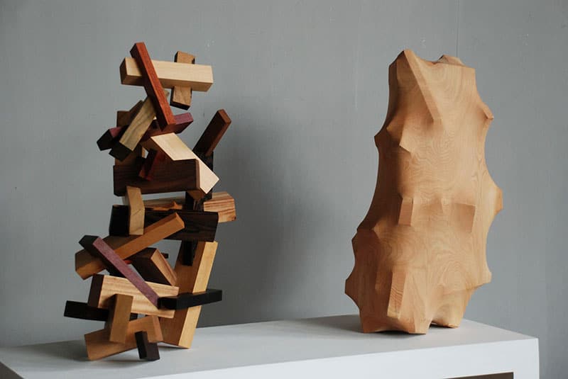 Artist creates wood sculptures that look like figures are trapped