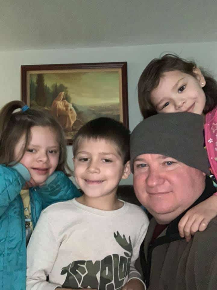 Daryl Andersen and the three siblings he adopted