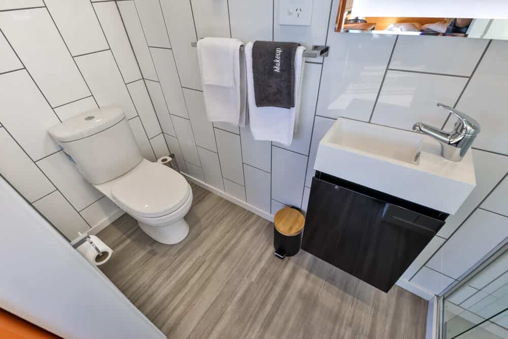 The flushing toilet inside a tiny house