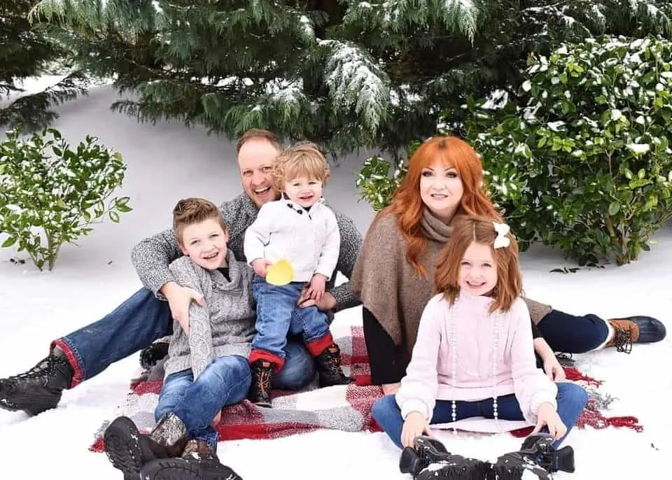 The Jones family posing for a photo on the snow
