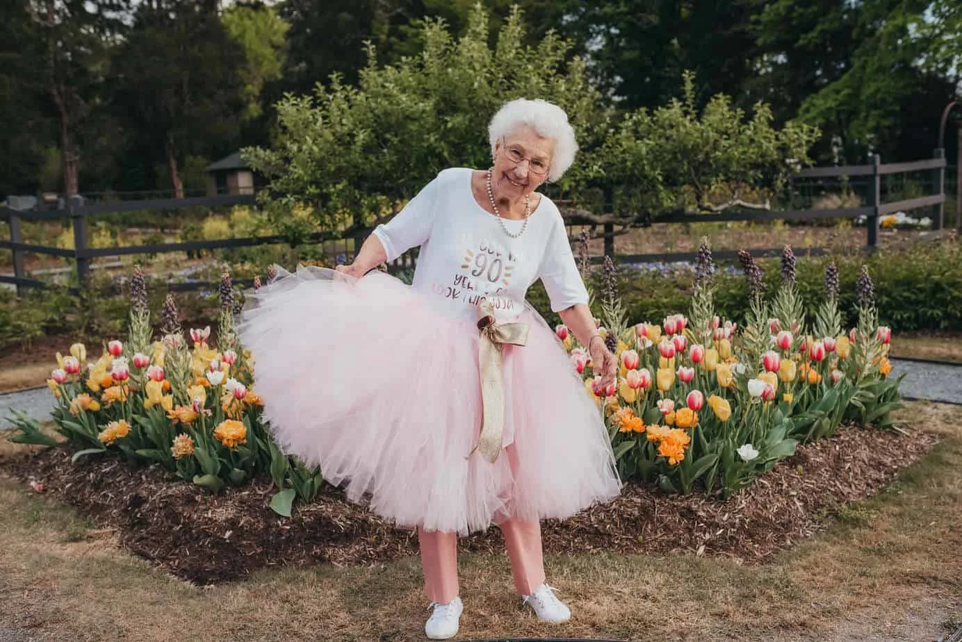 A grandma wearing a pink tutu