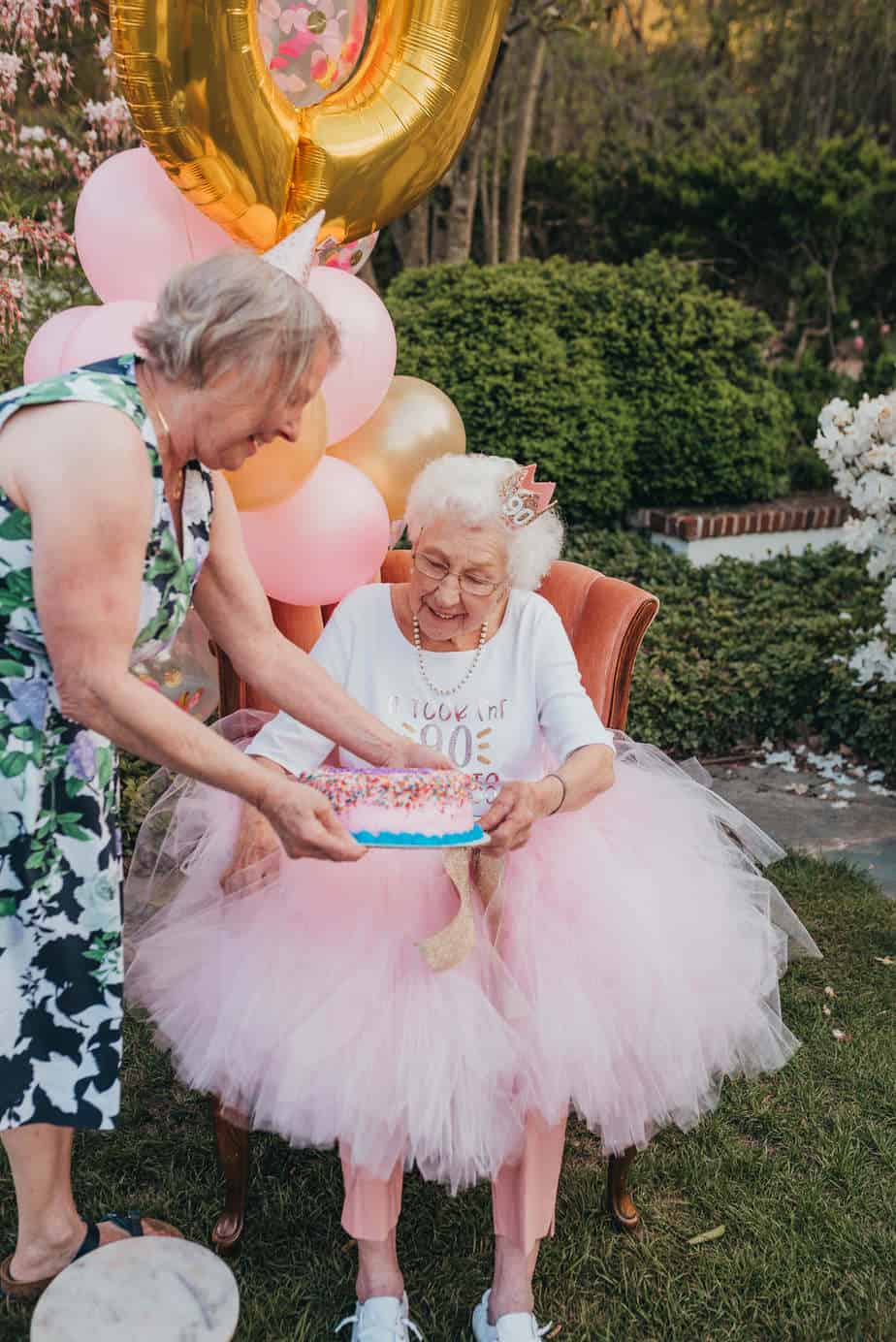 A grandma receiving her birthday cake