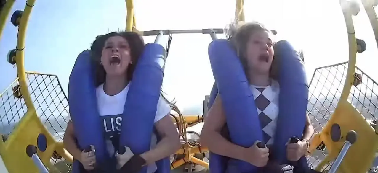 Kiley Holman and Georgia Reed screaming while on the slingshot ride