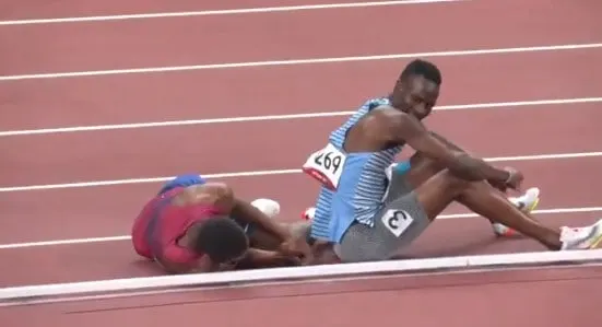 Isaiah Jewett and Nijel Amos after falling on the track