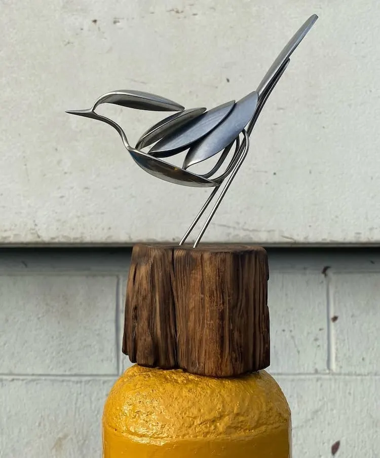 A bird sculpture made from metal