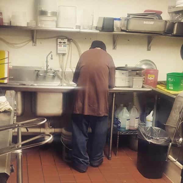 Marcus washing the dishes