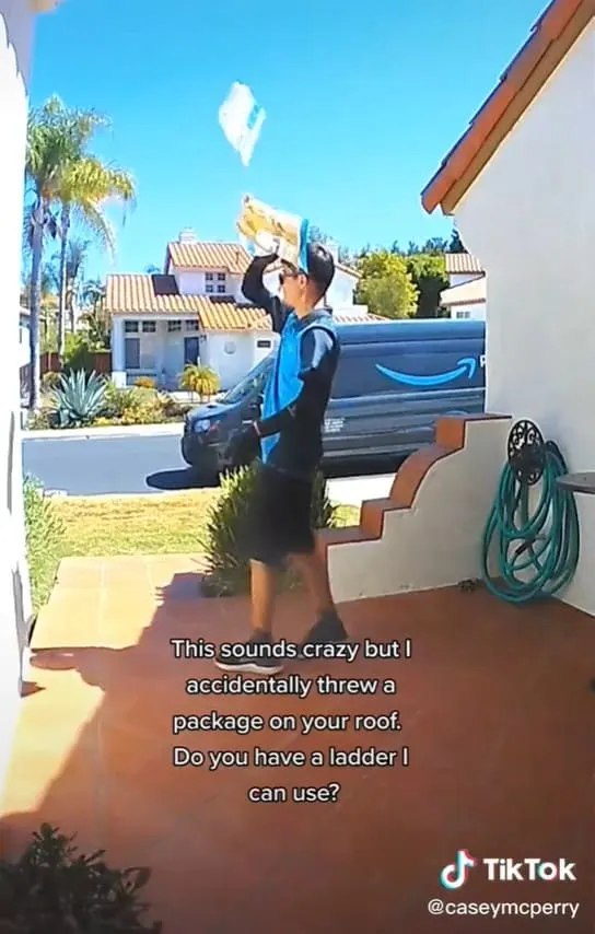 Amazon delivery driver accidentally tossing a package onto the roof