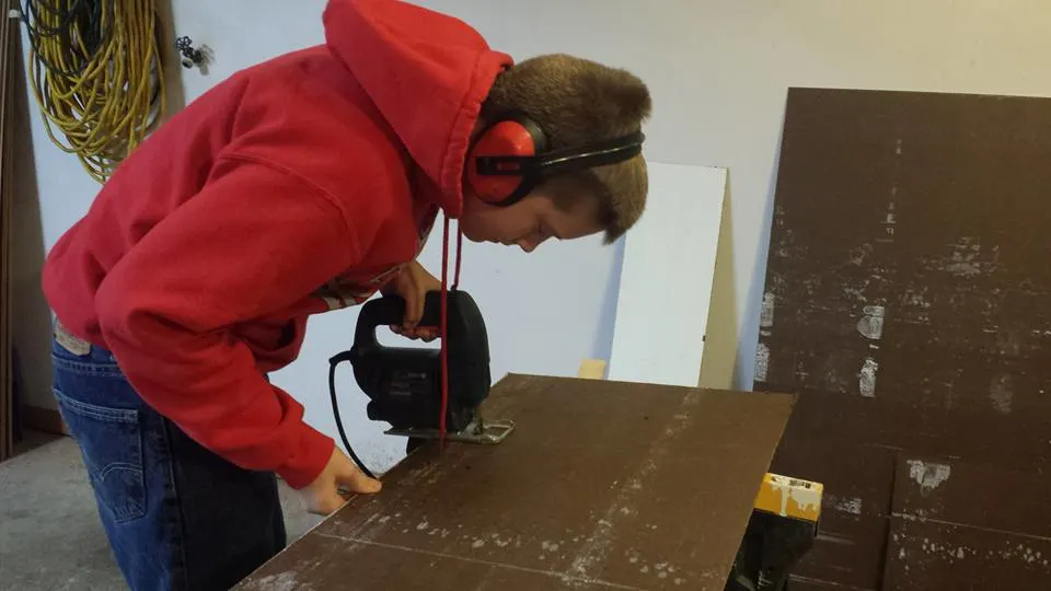 Luke Thill working on the construction of his tiny home