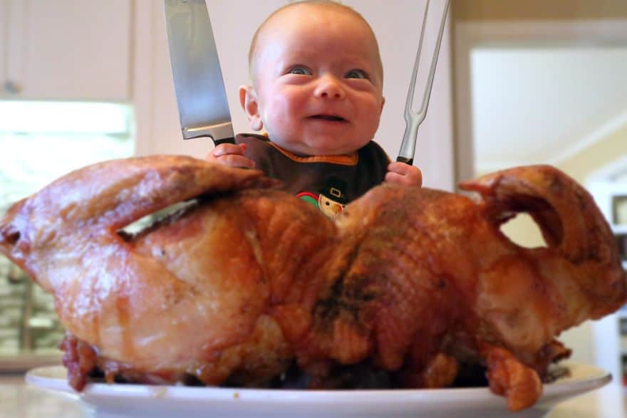A Photoshopped picture of baby Ryan about to devour a roasted turkey