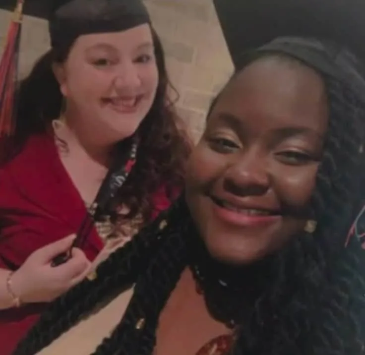 Imunique Triplett sharing a graduation selfie with another female student
