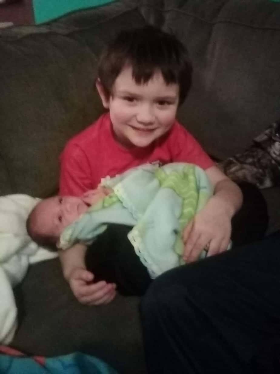 Bentley Williams holding his late brother Cordell Williams, Jr. 