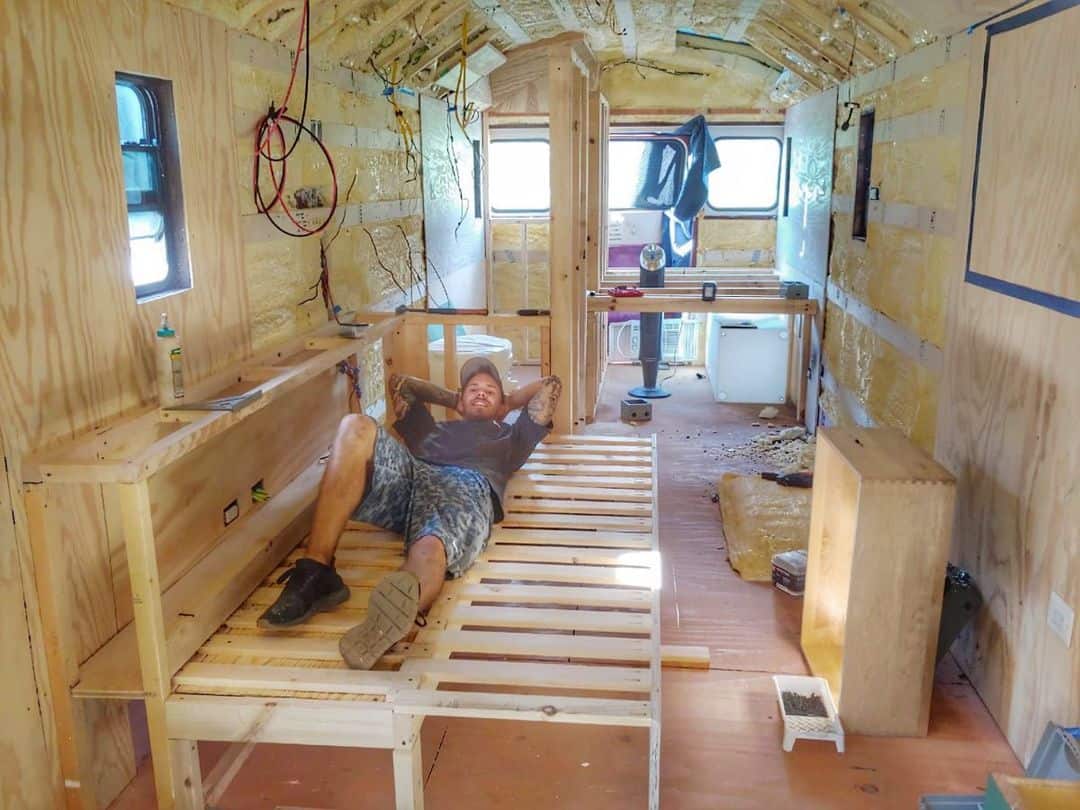 Craig Gordnier inside the school bus during its renovation