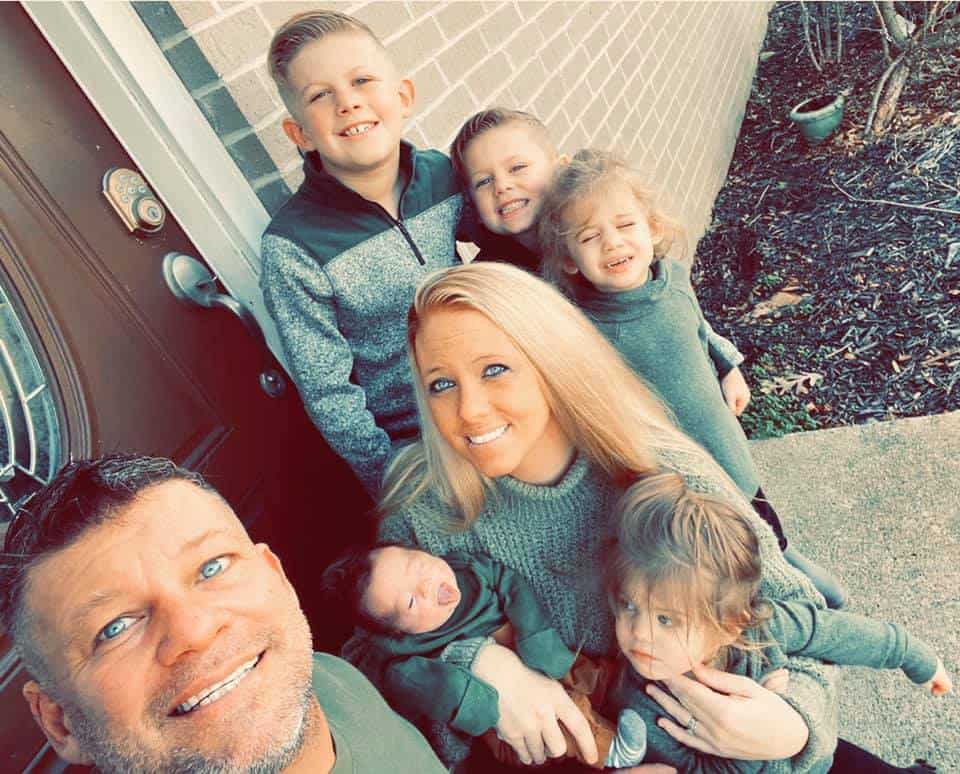 Nicole Powell with her husband and five kids