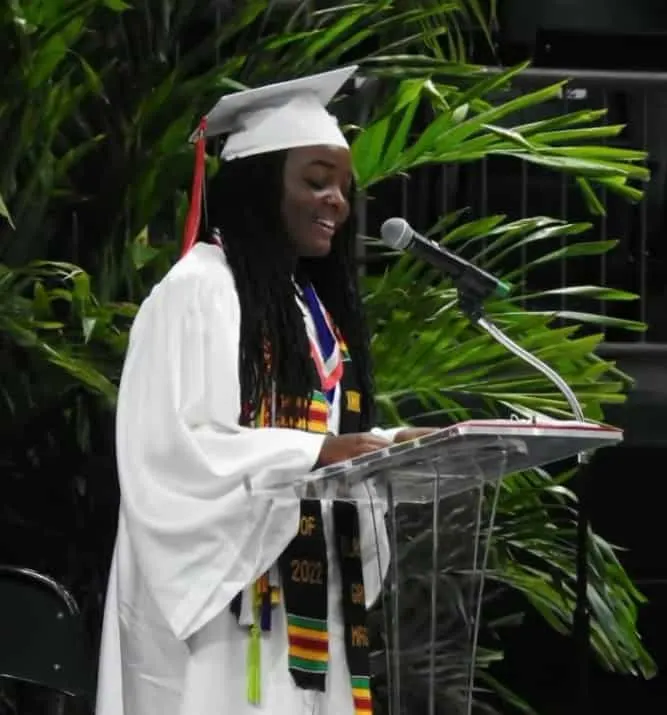 Ashley Adirika giving a speech during her high school graduation