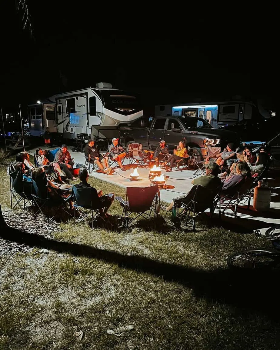 The Garcias enjoy a night out around a camp fire with others in the full time RV living community.