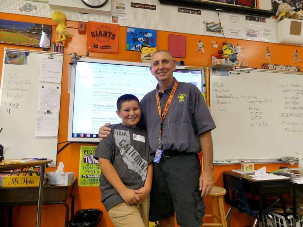 Janitor-turned-teacher with his student; a success story