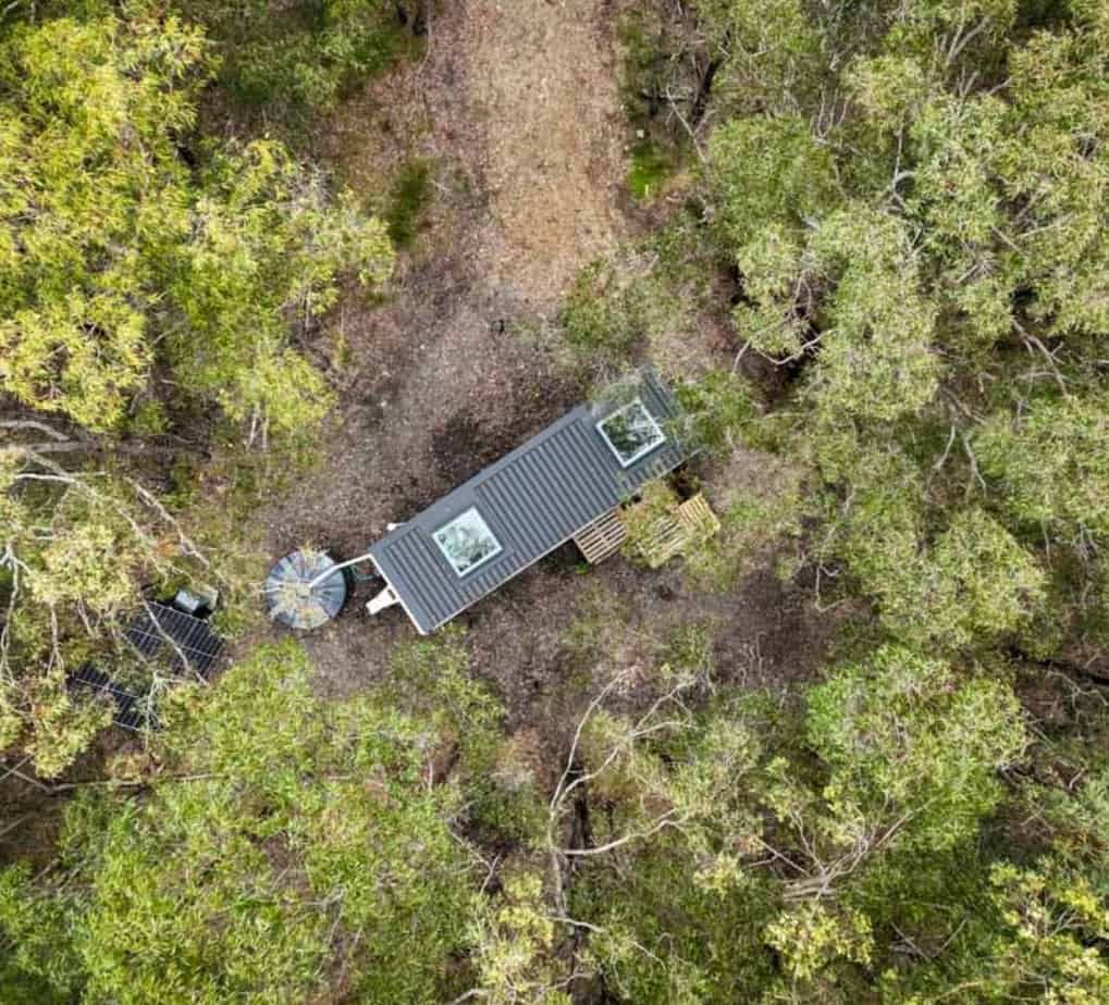Aerial view of Jess's tiny house in the middle of the woods.