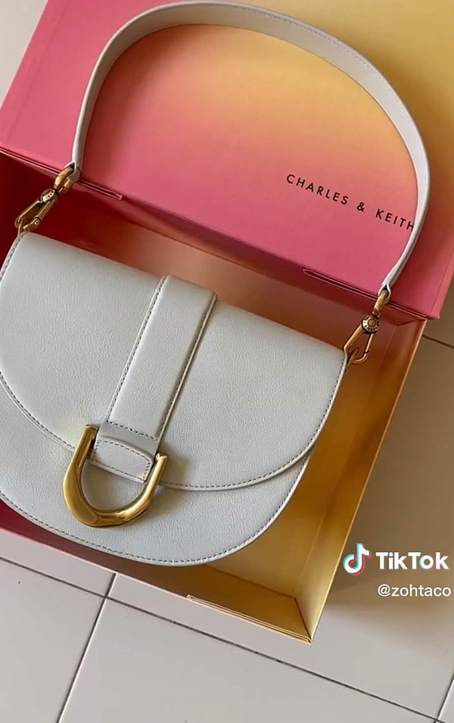 White hand bag from Charles & Keith.