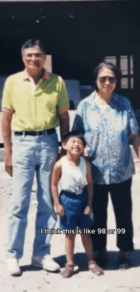Punsalan as a young boy with his grandparents.