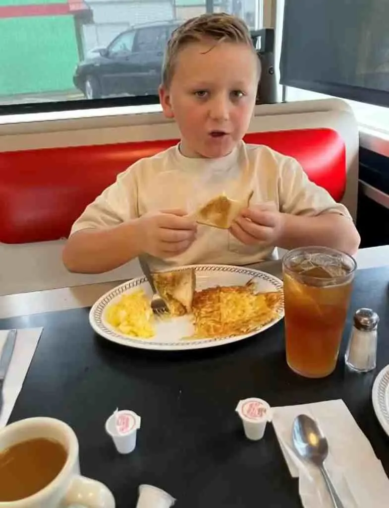 Kayzen, eating his favorite meal at Waffle House.