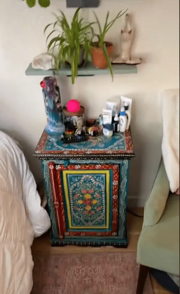 Her eclectric nightstand adds to the hippie vibe of the room.