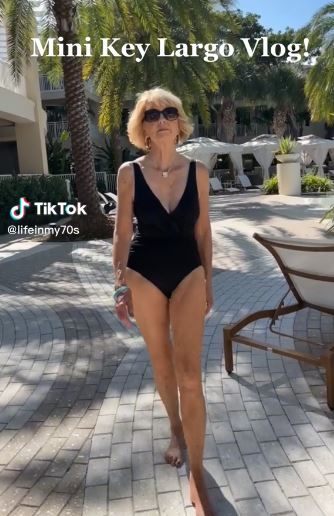 Fashion blogger Candace in a black swimsuit