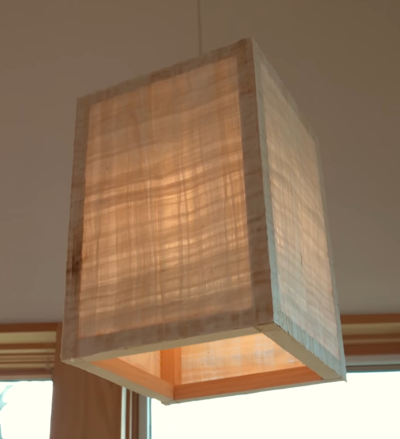 Papyrus paper lamp in modern cabin's dining area.