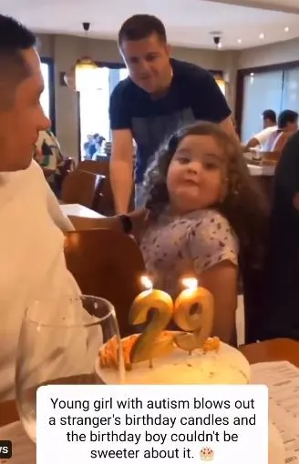 Child with autism comes to blow stranger's birthday cake