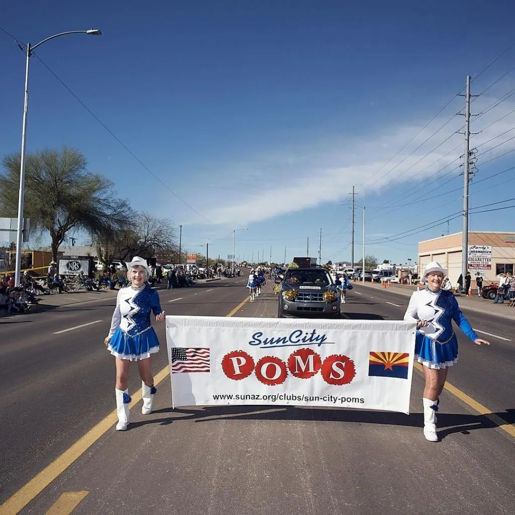 The Sun City Poms have fun during one of their parades.