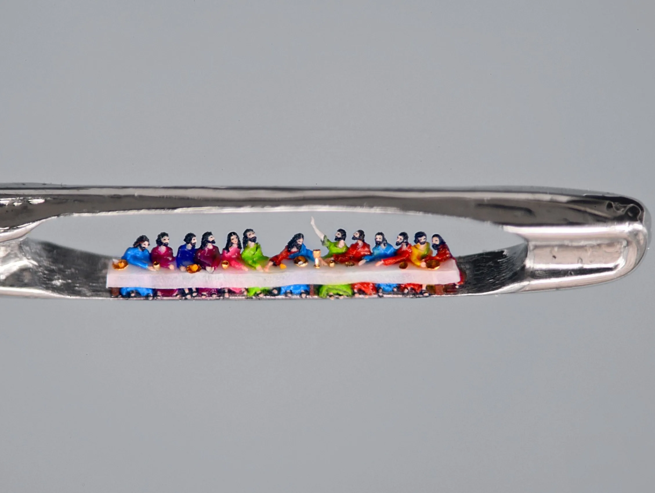 Tiniest "Last Supper" sculpture in the eye of a needle.