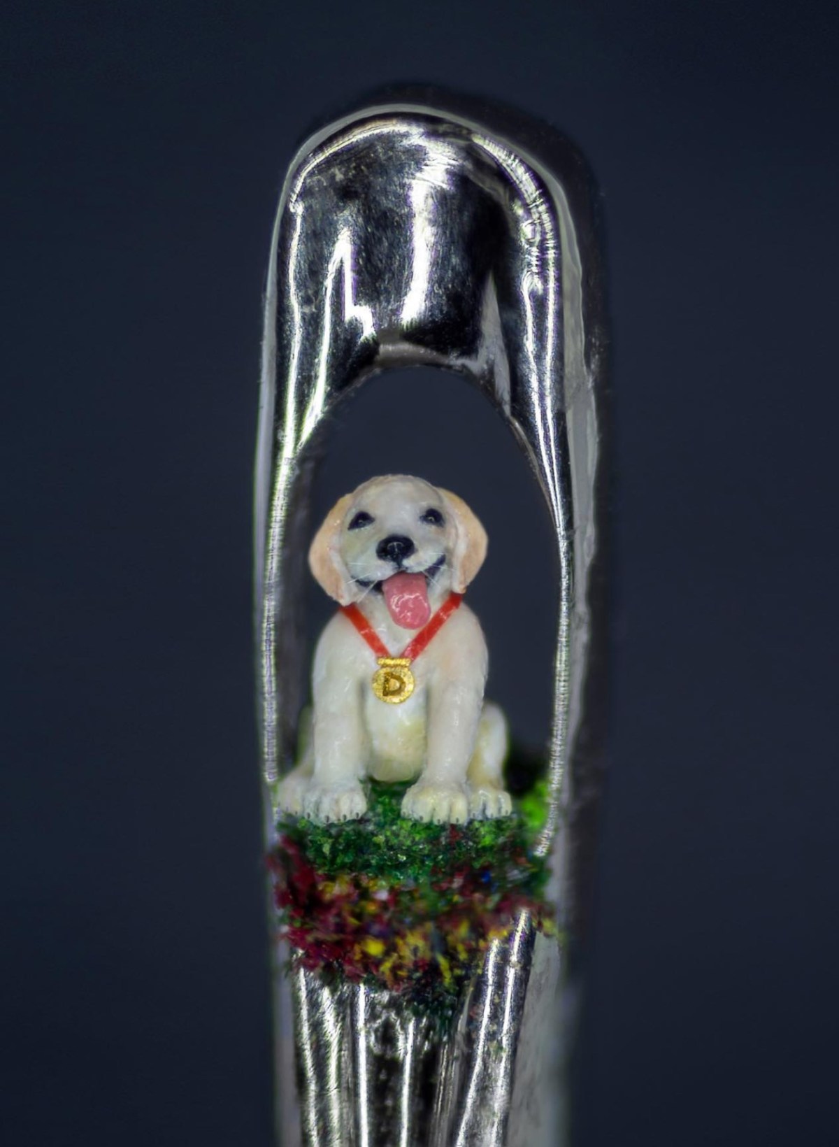 The tiniest handmade sculptures that fit in the eye of a needle
