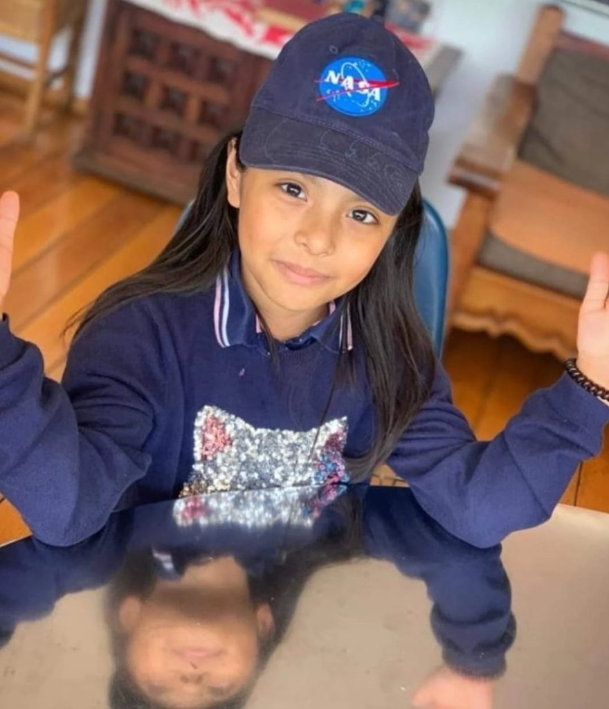 A photo of Adhara wearing a NASA cap.