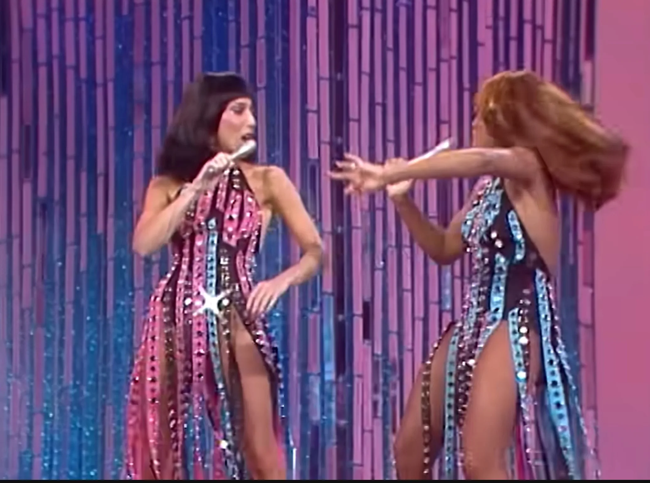 Tina Turner and Cher dancing and singing "Shame, Shame Shame."