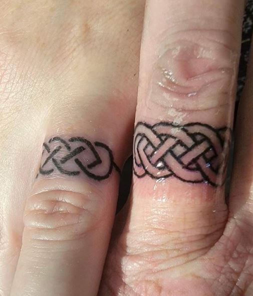 Jamie and Drew's wedding ring finger tattoos