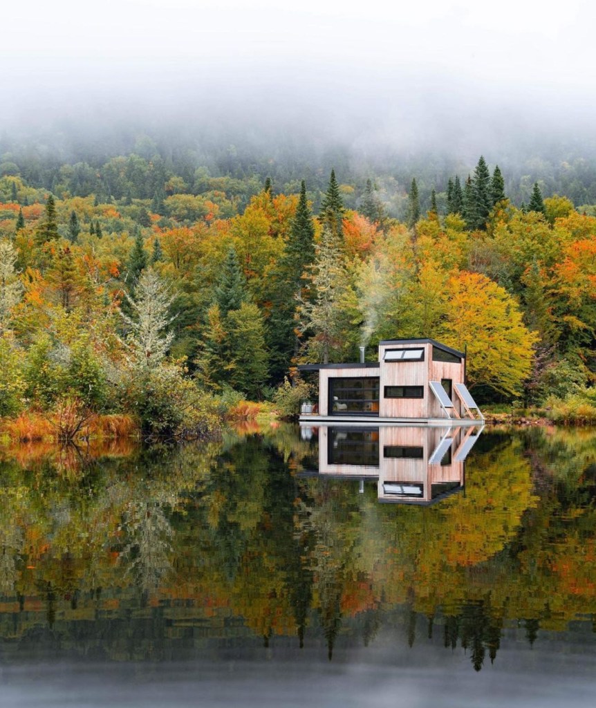 View of Bora Boreal float home from the lake during autumn.