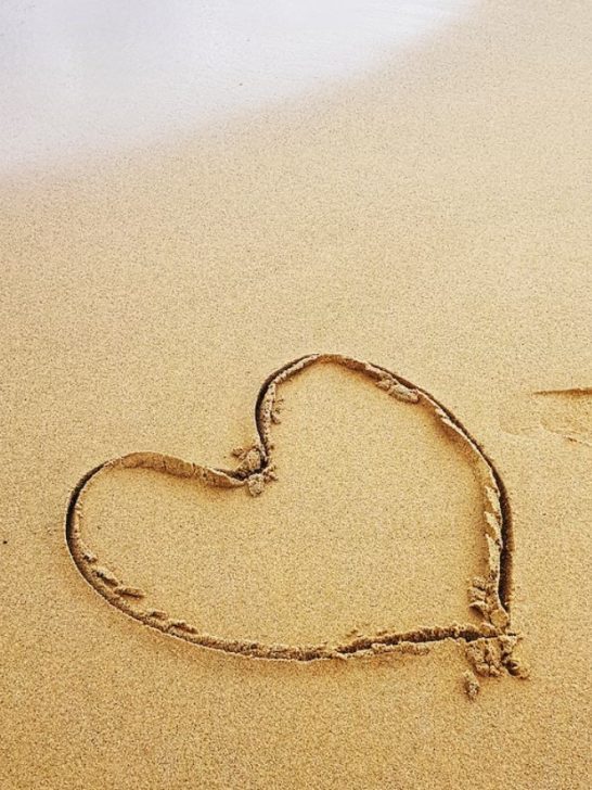 Heart drawn on the sand.