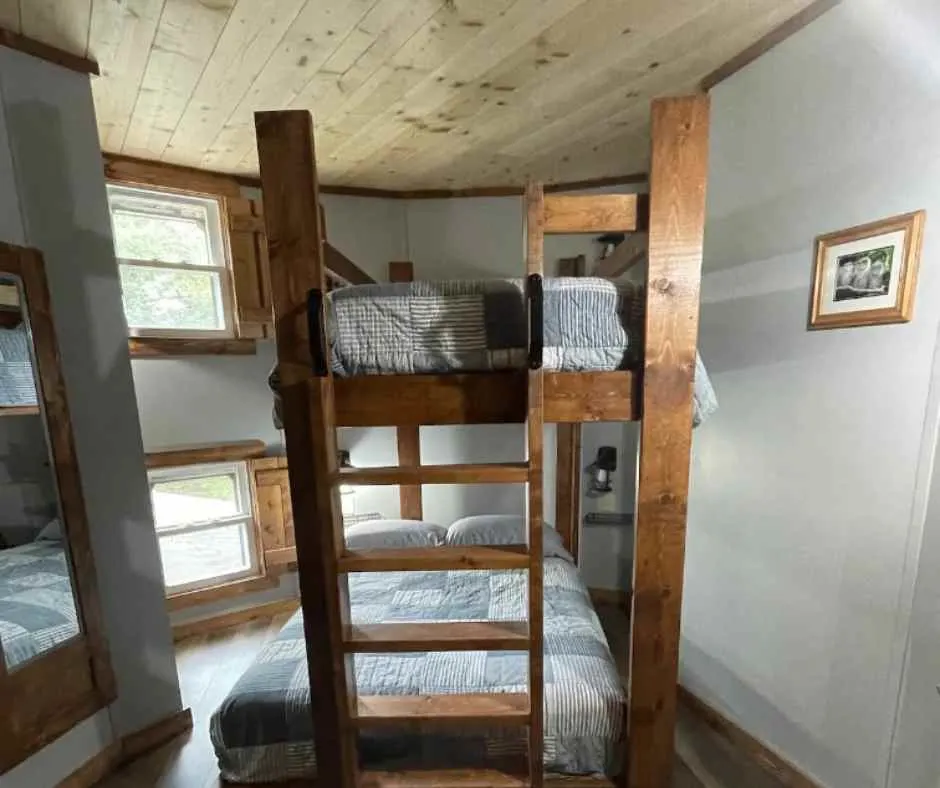 Bedroom for three inside Owl's Nest Silo House.