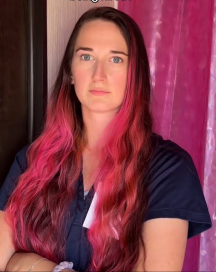 Bonschoter has gloriously long pink hair, which is not allowed at work.