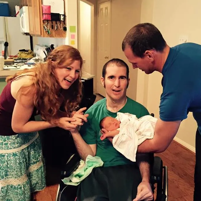 On one of their frequent visits, Kristen and James introduce Brandon to their new baby.