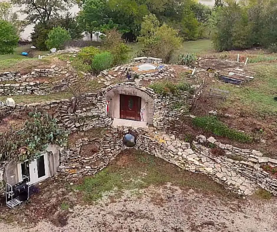 Aerial shot of Al's unique home showing how it blends with Earth.
