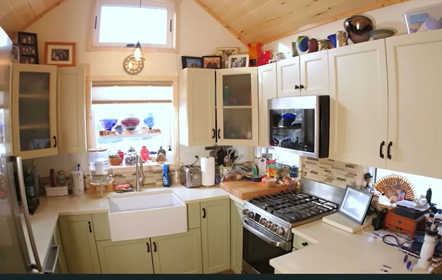 The kitchen folds a full-sized refrigerator, stove and oven, microwave, and dishwasher.
