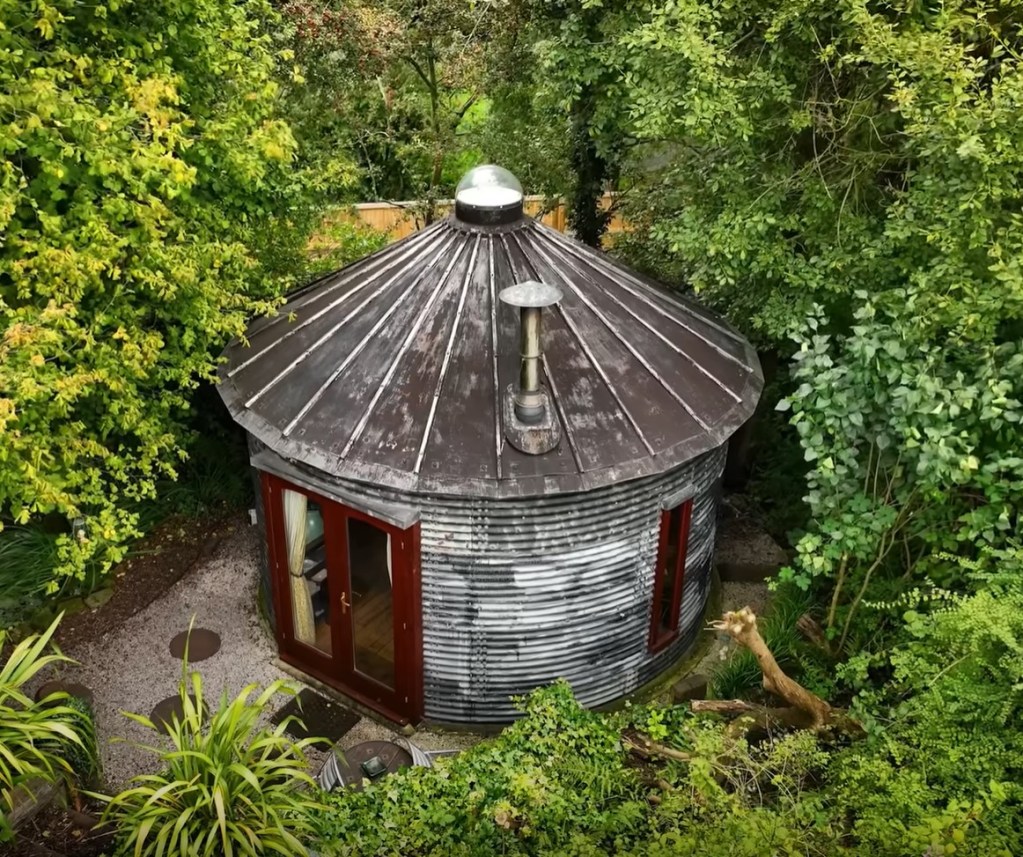 An aerial view of the tiny home, formerly an old grain silo.