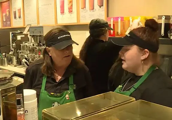 Karen Collinsworth talks to her Starbucks co-worker.